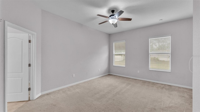 carpeted empty room with ceiling fan