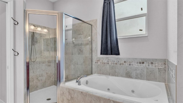 bathroom with separate shower and tub