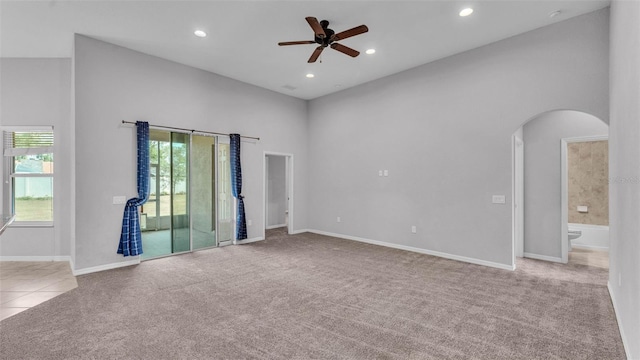 212 Kissengen Park Dr, Bartow, FL 33830 - spare room featuring carpet flooring, arched walkways, a ceiling fan, recessed lighting, and baseboards