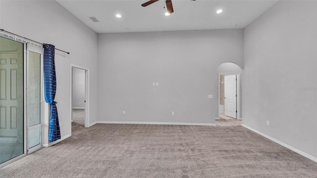212 Kissengen Park Dr, Bartow, FL 33830 - spare room with a ceiling fan, carpet flooring, arched walkways, baseboards, and recessed lighting