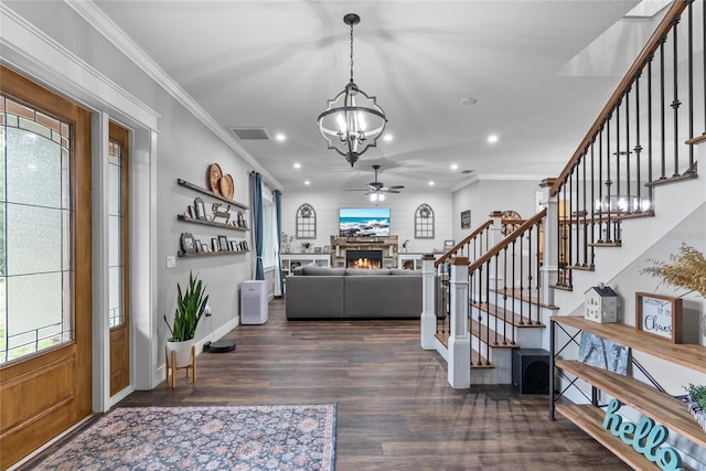 entrance foyer featuring hardwood / wood-style flooring, crown molding, and a healthy amount of sunlight