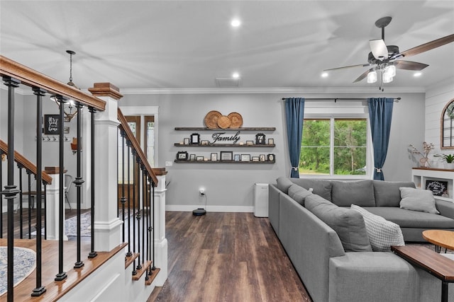 living room with ceiling fan, dark wood-type flooring, and ornamental molding