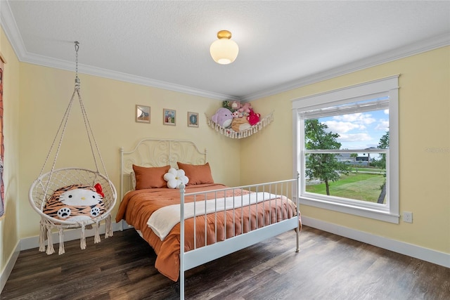 bedroom with crown molding and dark hardwood / wood-style floors