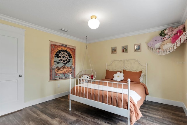 bedroom featuring dark wood-type flooring and crown molding