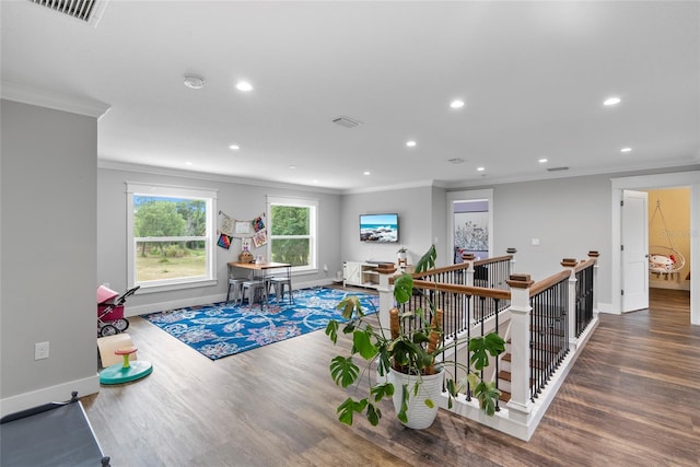 interior space featuring crown molding and wood-type flooring