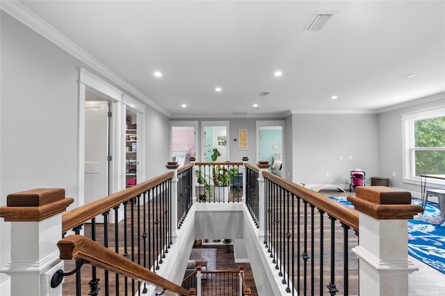 hall with crown molding and hardwood / wood-style flooring