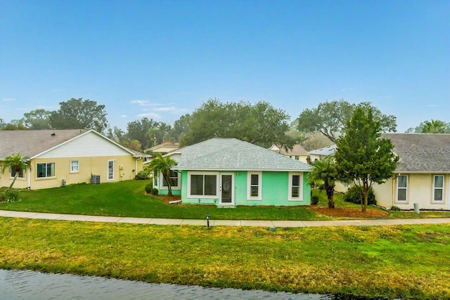 single story home featuring a front yard