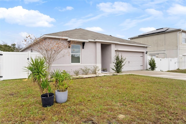 view of front of house with a garage and a front lawn