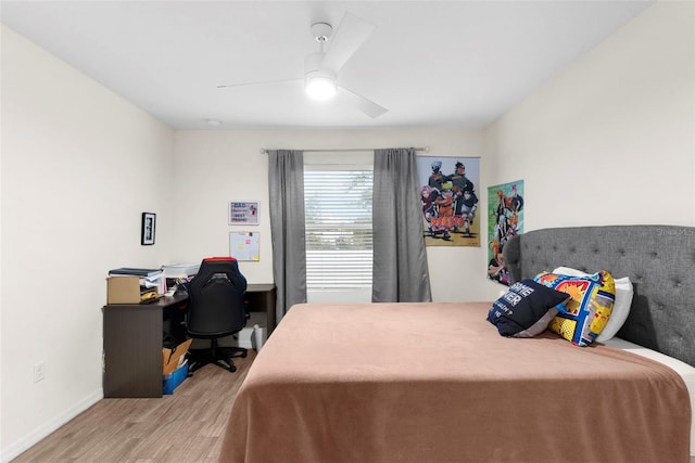 bedroom with light hardwood / wood-style floors and ceiling fan