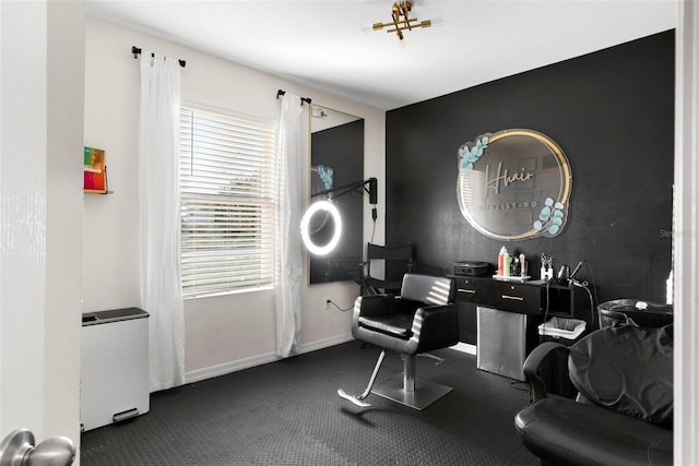 miscellaneous room featuring dark colored carpet