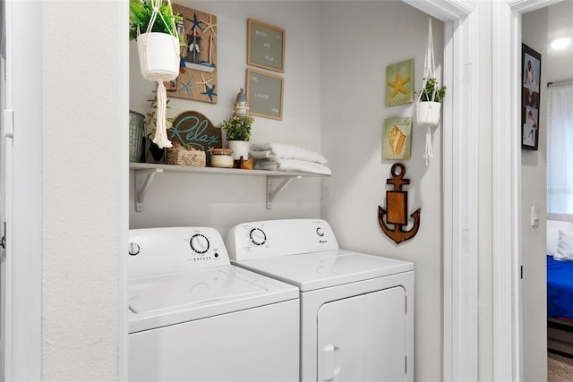 laundry area with washing machine and dryer