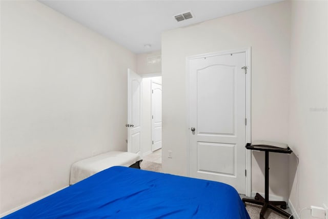 bedroom featuring light colored carpet