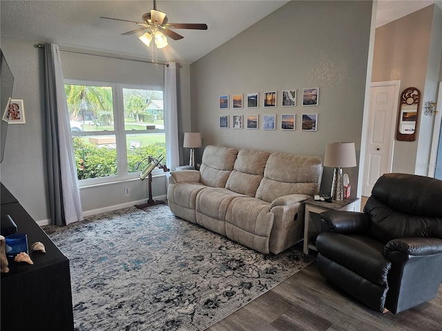 living room featuring ceiling fan, wood-type flooring, and lofted ceiling