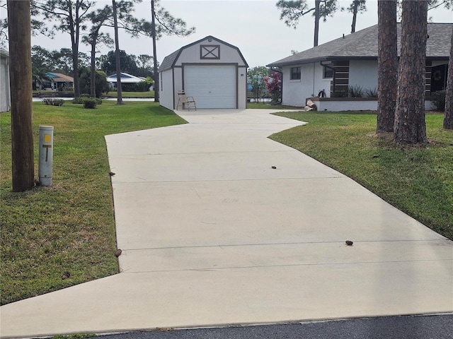 exterior space with an outbuilding, a yard, and a garage