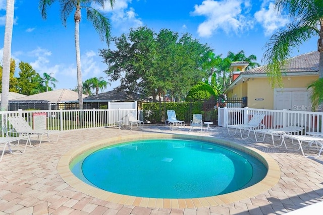 view of swimming pool with a patio area