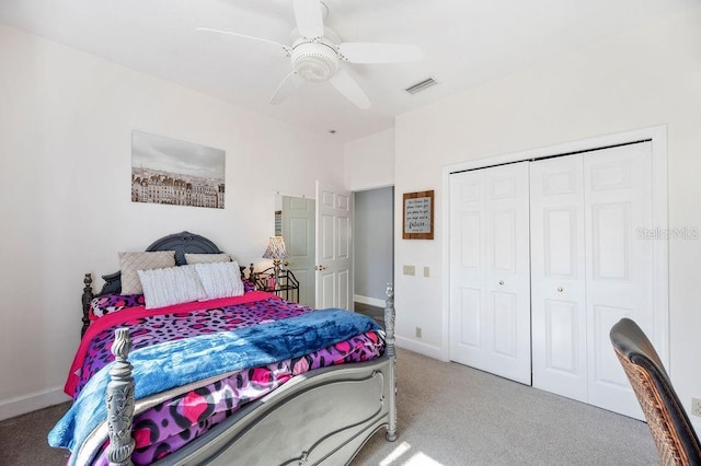 bedroom featuring a closet, ceiling fan, and carpet flooring