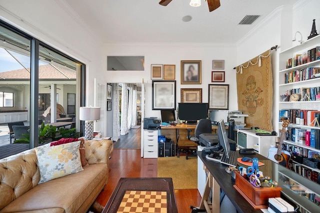 office space with ceiling fan, ornamental molding, and dark hardwood / wood-style flooring