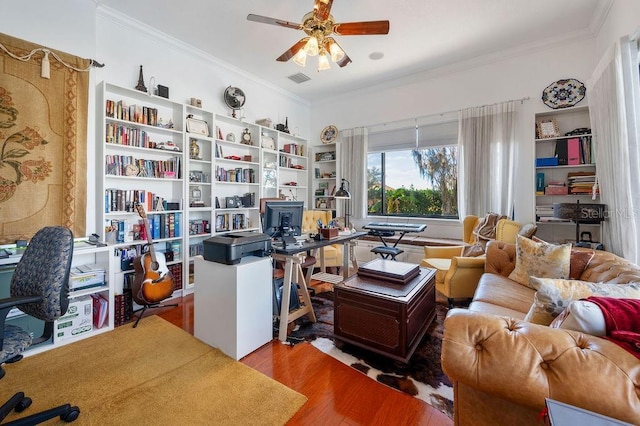 office space with ornamental molding, hardwood / wood-style floors, and ceiling fan