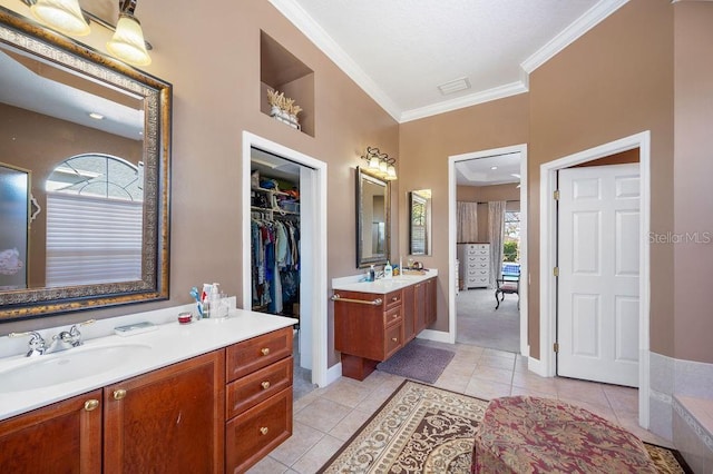 bathroom featuring tile patterned flooring, vanity, and ornamental molding