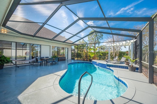 view of pool featuring a patio and glass enclosure