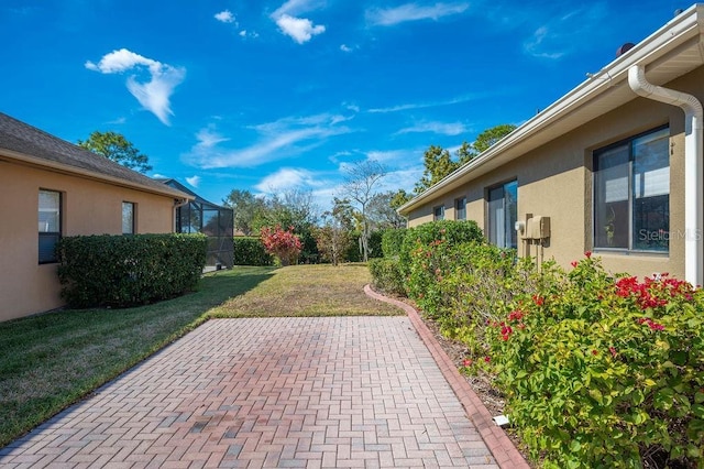 view of patio with a lanai