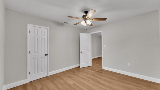 unfurnished bedroom featuring ceiling fan and light wood-type flooring