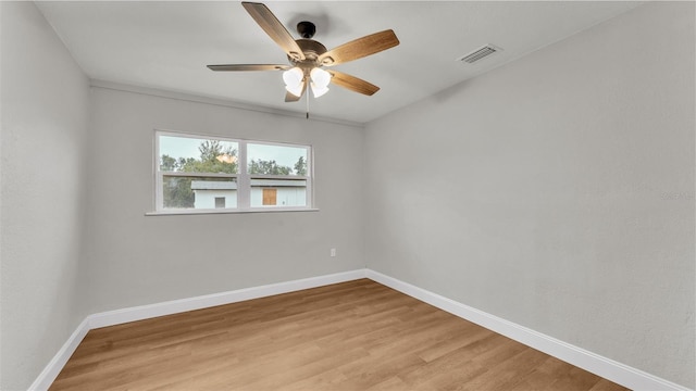 empty room with light wood-type flooring and ceiling fan