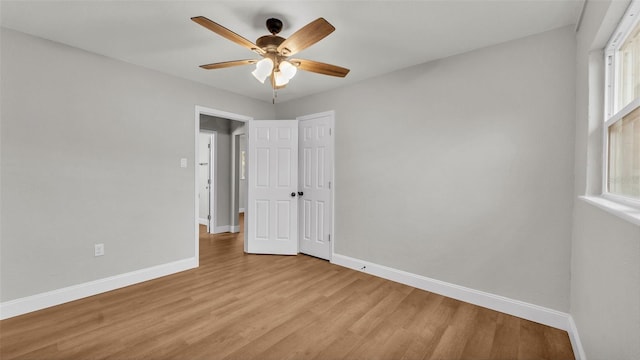 unfurnished bedroom featuring ceiling fan and light hardwood / wood-style floors