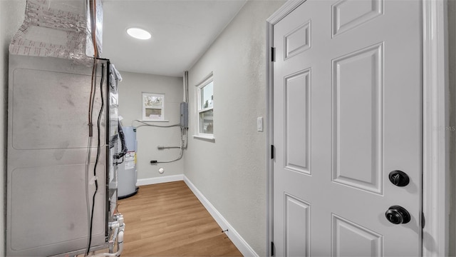 utility room with electric water heater