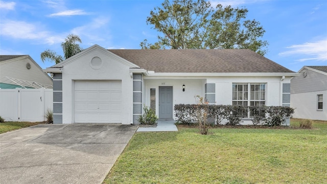 ranch-style house with a garage and a front yard