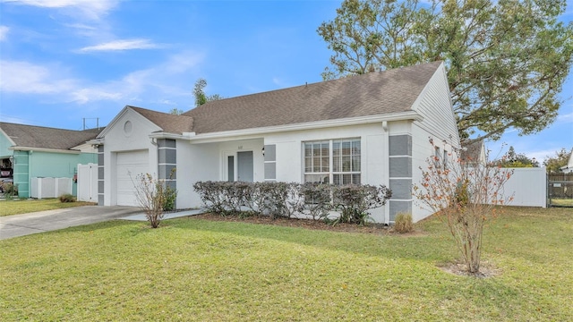 ranch-style house featuring a garage and a front yard