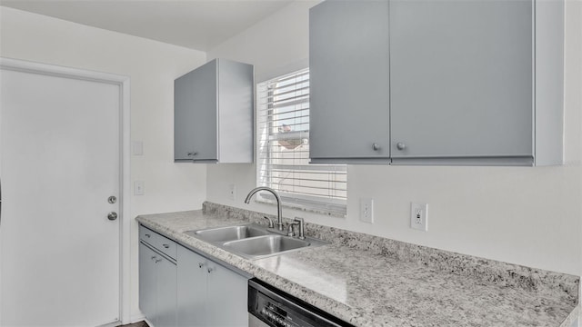 kitchen with sink, gray cabinets, and dishwasher