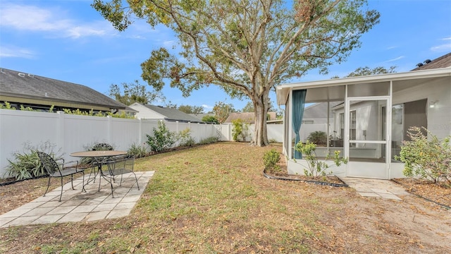 view of yard featuring a sunroom