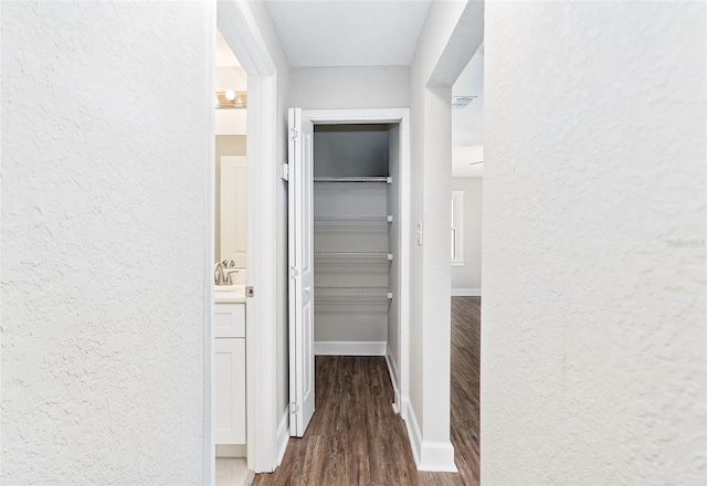 corridor featuring dark hardwood / wood-style floors