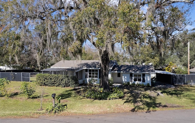 ranch-style house with a front lawn and a carport