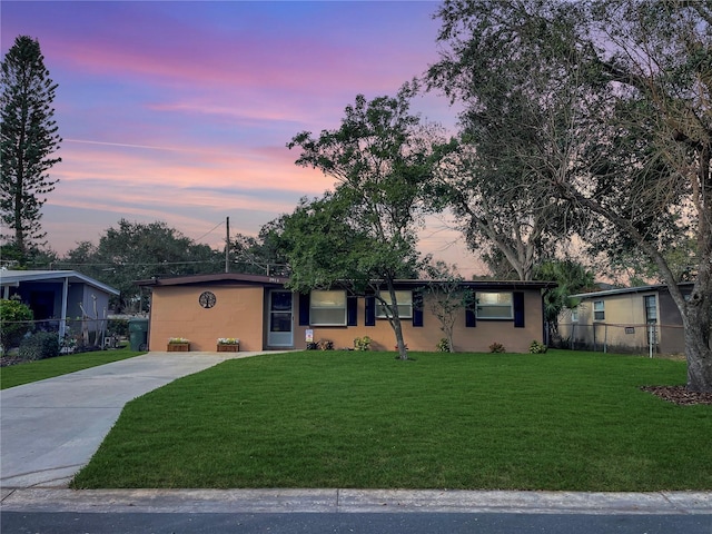 ranch-style house with a yard