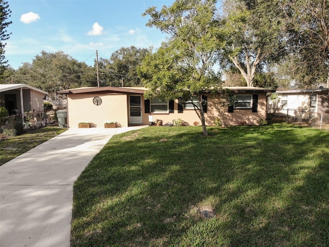 ranch-style house with a front lawn