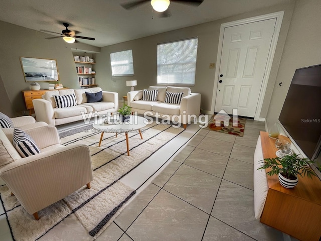 living room with ceiling fan and tile patterned floors