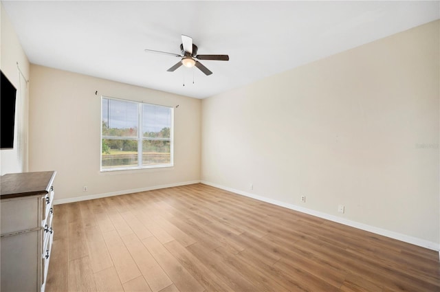 unfurnished living room with ceiling fan and light hardwood / wood-style floors