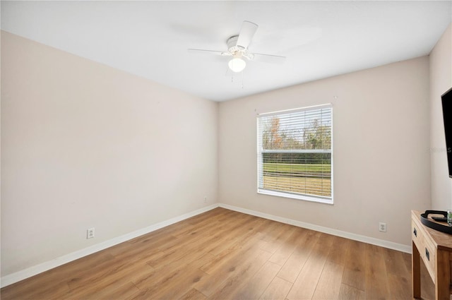 empty room featuring ceiling fan and light hardwood / wood-style floors