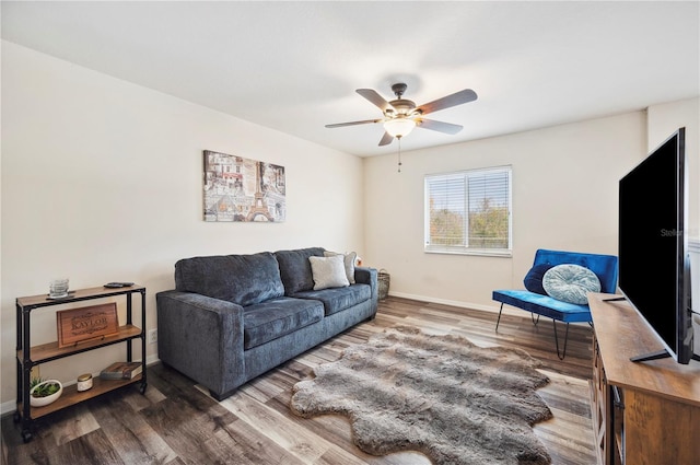 living room featuring ceiling fan and wood-type flooring