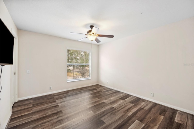 unfurnished room with dark hardwood / wood-style flooring and ceiling fan