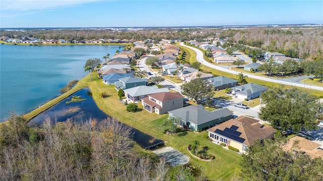 birds eye view of property featuring a residential view and a water view