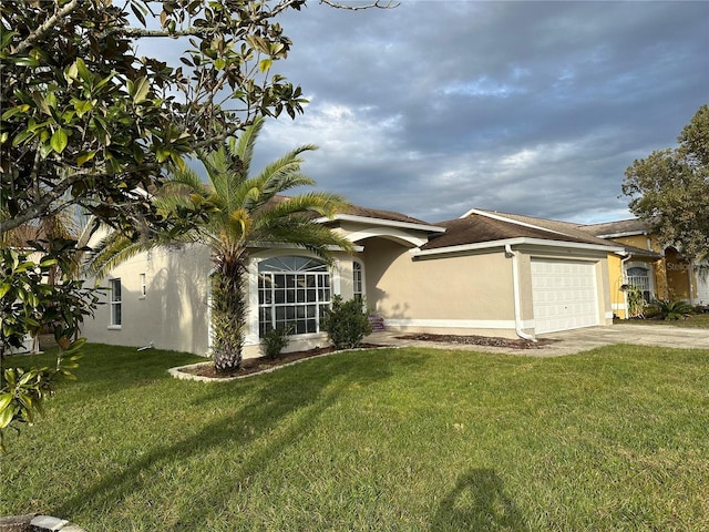 view of front facade featuring a garage and a front lawn