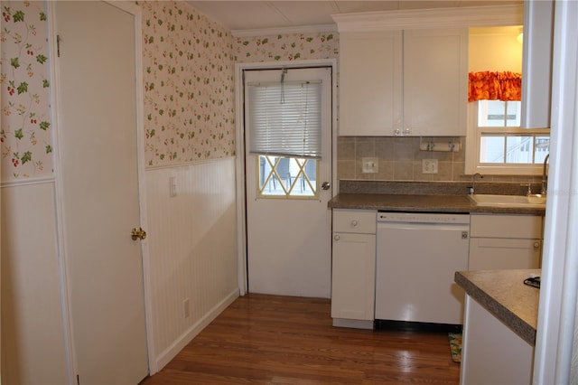 kitchen with white cabinetry, dishwasher, and sink