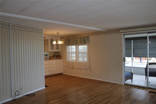 interior space with hardwood / wood-style flooring and a notable chandelier