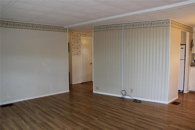 spare room featuring dark hardwood / wood-style flooring