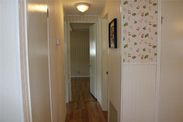 hallway featuring dark hardwood / wood-style flooring