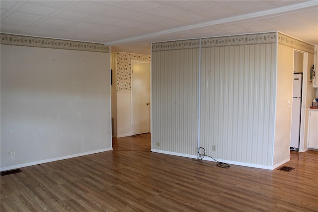 spare room with hardwood / wood-style floors