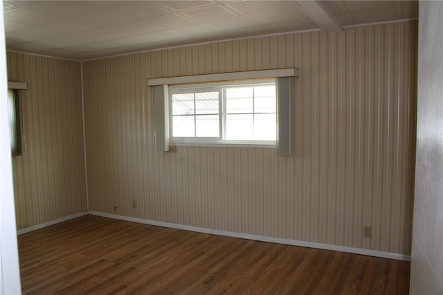 unfurnished room with hardwood / wood-style flooring